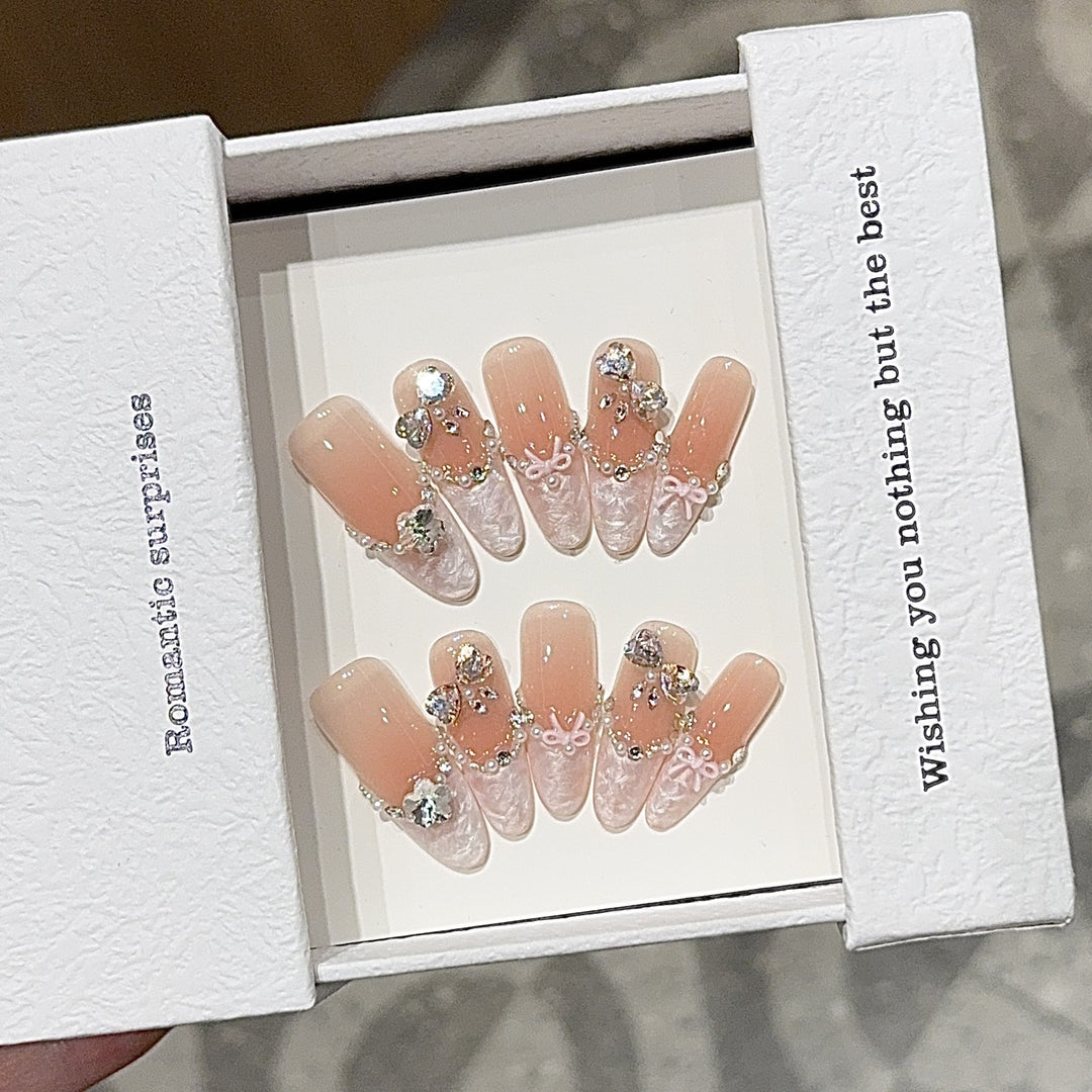 Artificial nails with romantic rhinestone details Stornfield