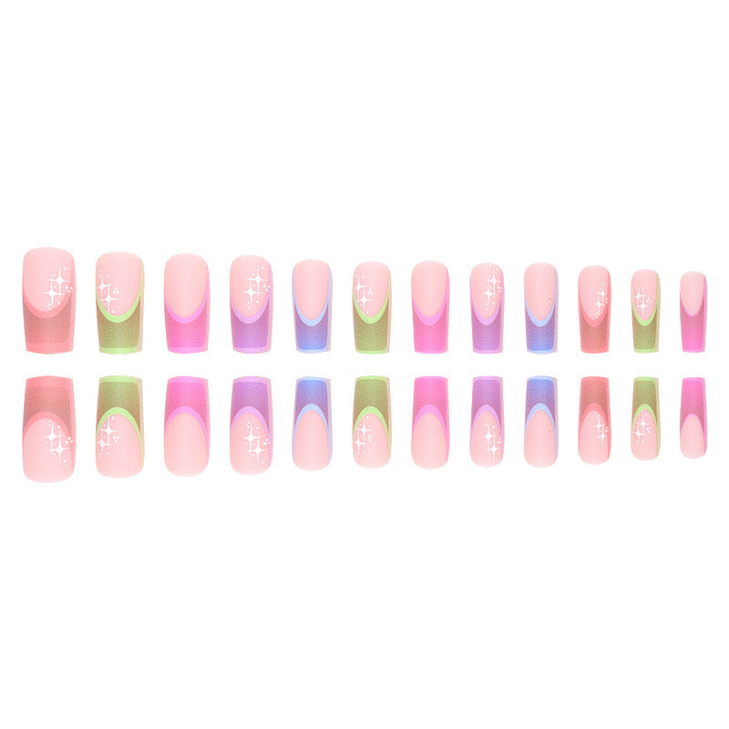 Acrylic nail set with colorful geometric designs and glitter accents Stornfield