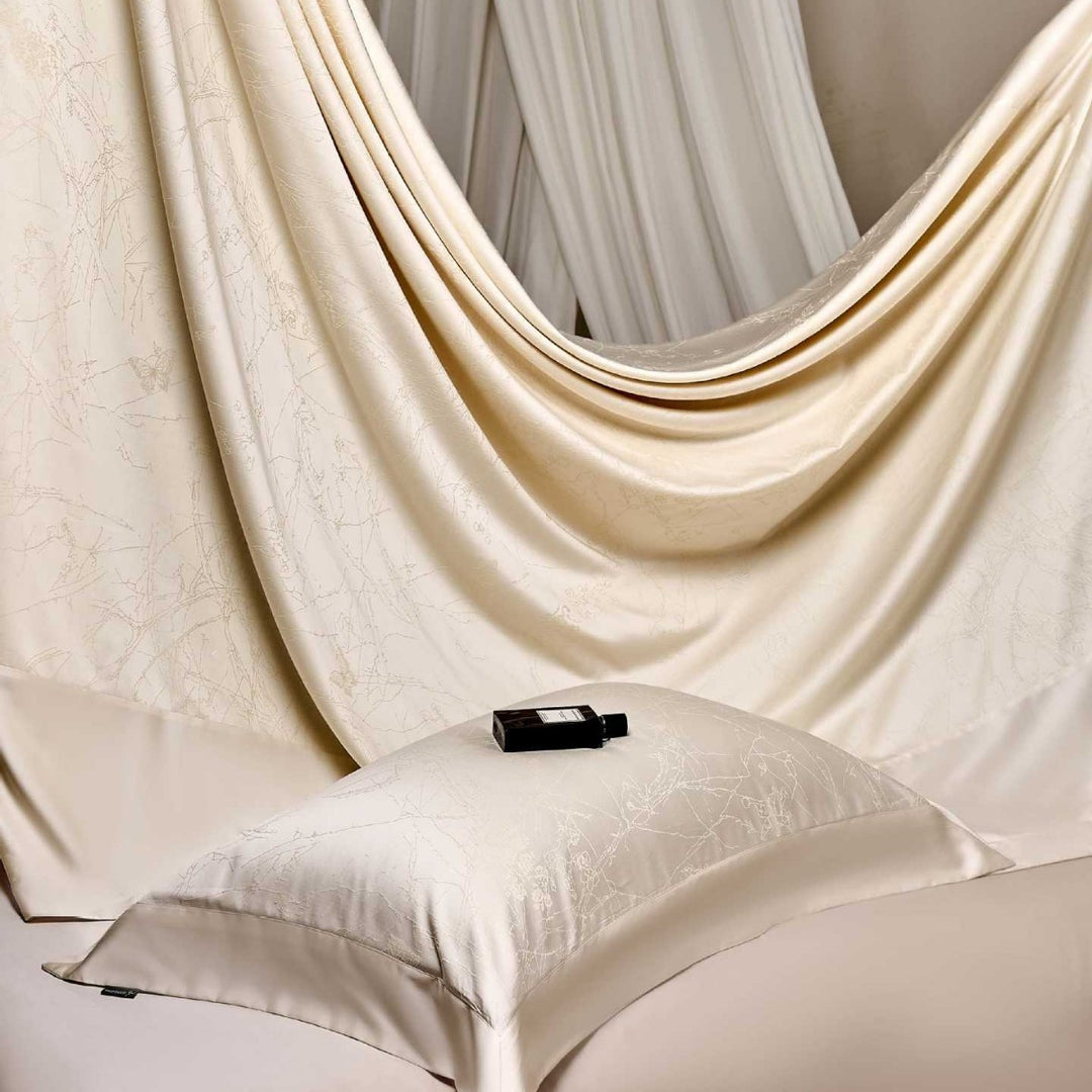 Satin bed linen set with floral jacquard texture and fine hem detail