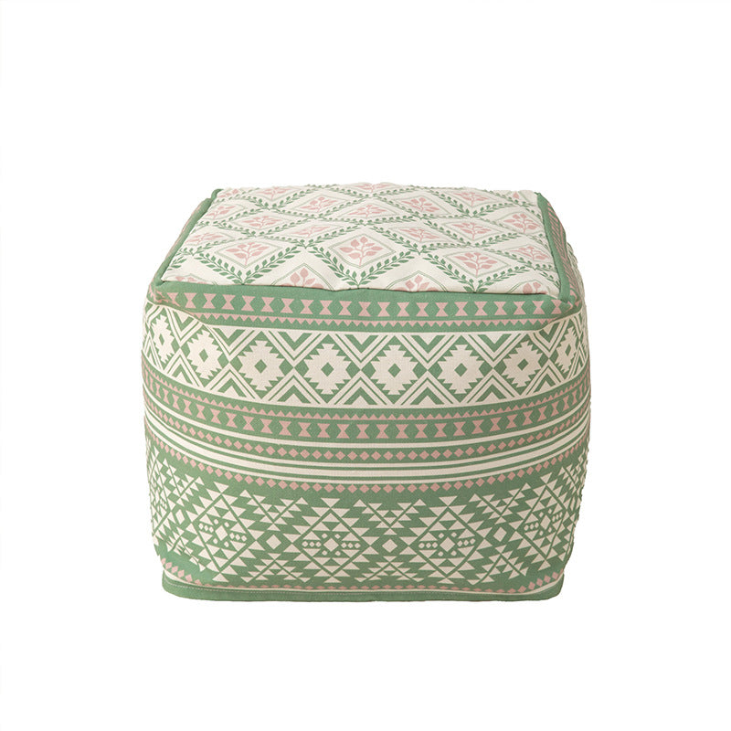 Round floor pouf with ethnic weaving pattern and practical carrying handle Stornfield