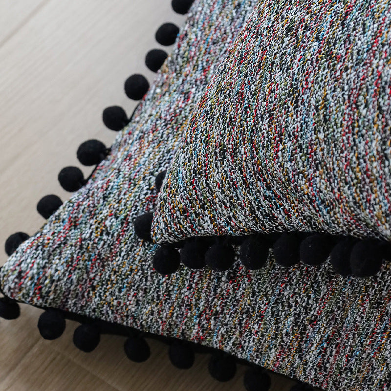 Playful decorative cushion with tassel edge