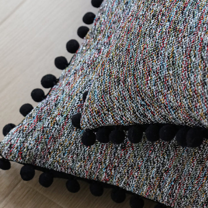 Playful decorative cushion with tassel edge