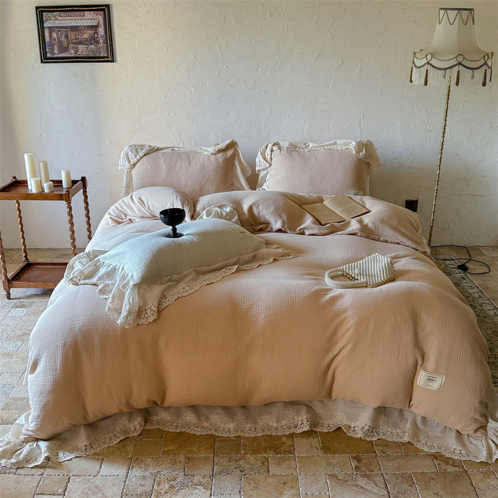 Vintage-inspired cotton muslin bedding set with wide lace ruffle and reversible function