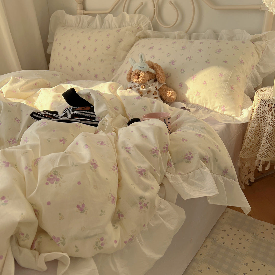 Romantic cotton satin bedding set with ruffled frills and fine floral pattern