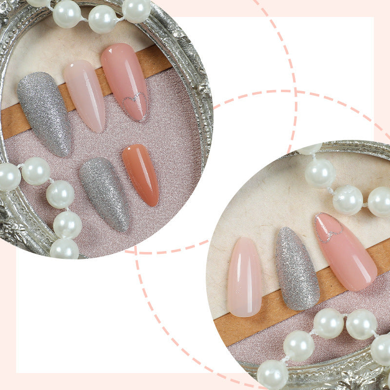 Acrylic nail set with heart and glitter design Stornfield