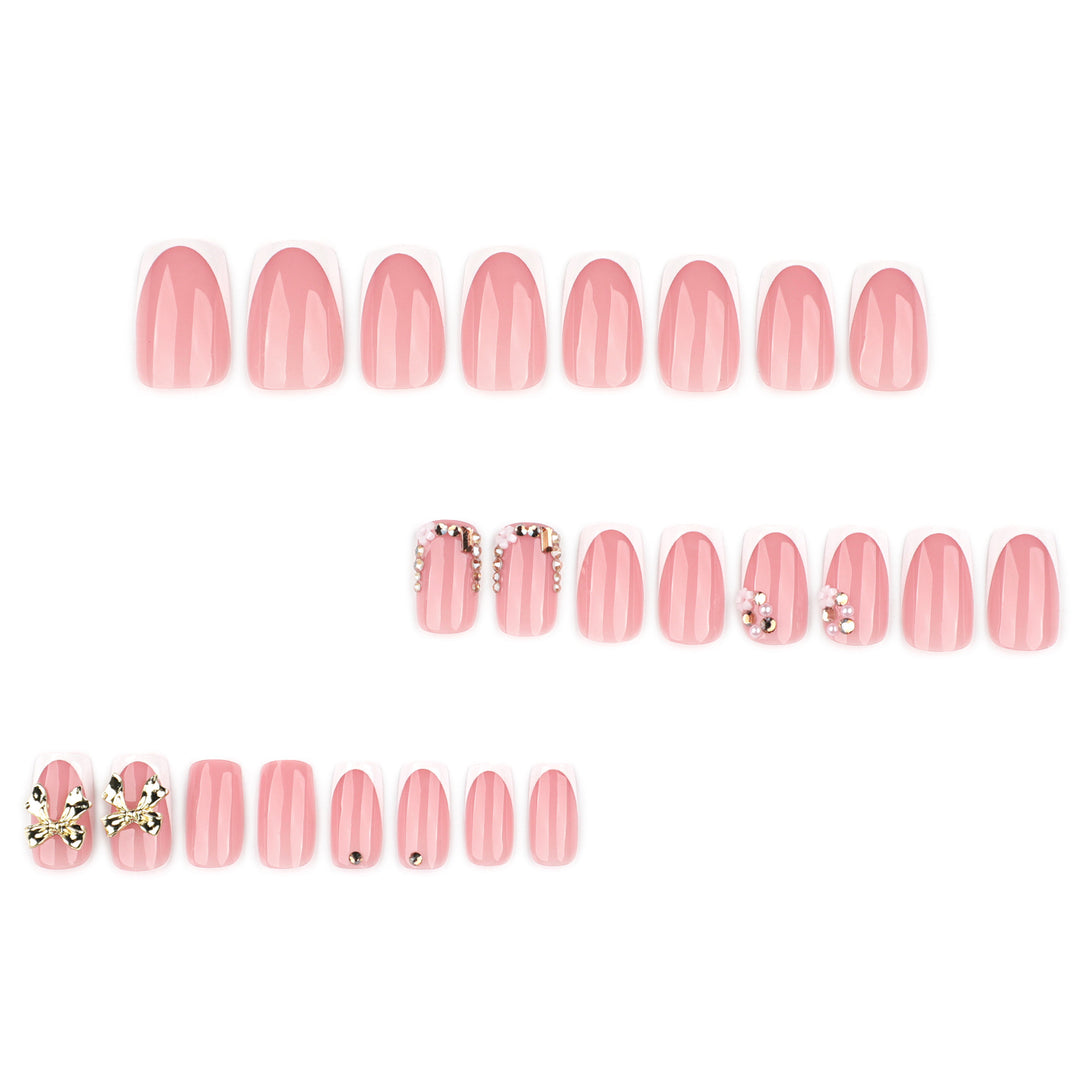 Elegant Nail Extensions with French Tips and Decorative Accents Stornfield