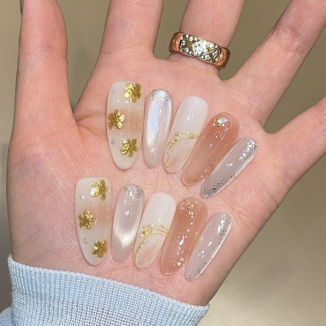 Artificial nails with floral decorations and glitter effects Stornfield