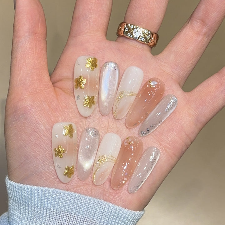 Artificial nails with floral decorations and glitter effects Stornfield