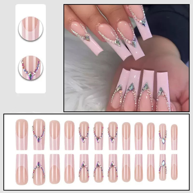 Glamorous artificial nails with sparkling rhinestone embellishments Stornfield