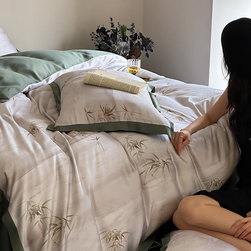 Luxurious satin bedding set with subtle bamboo print and contrasting decorative piping