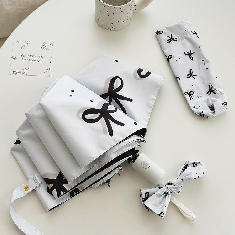 Women’s Folding Umbrella with Playful Bow Pattern Stornfield