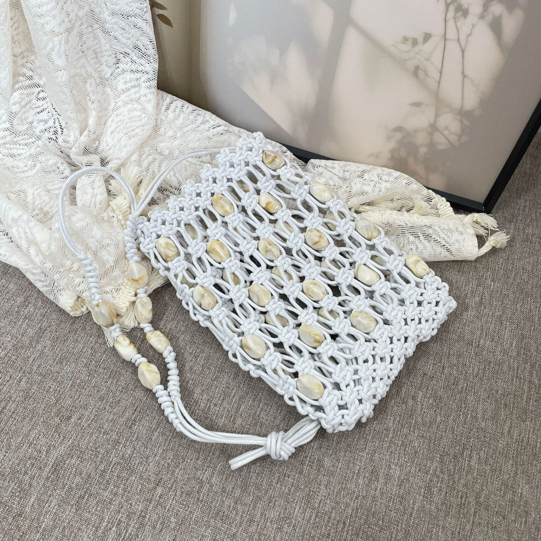 Hand-knotted shoulder bag with shells Stornfield