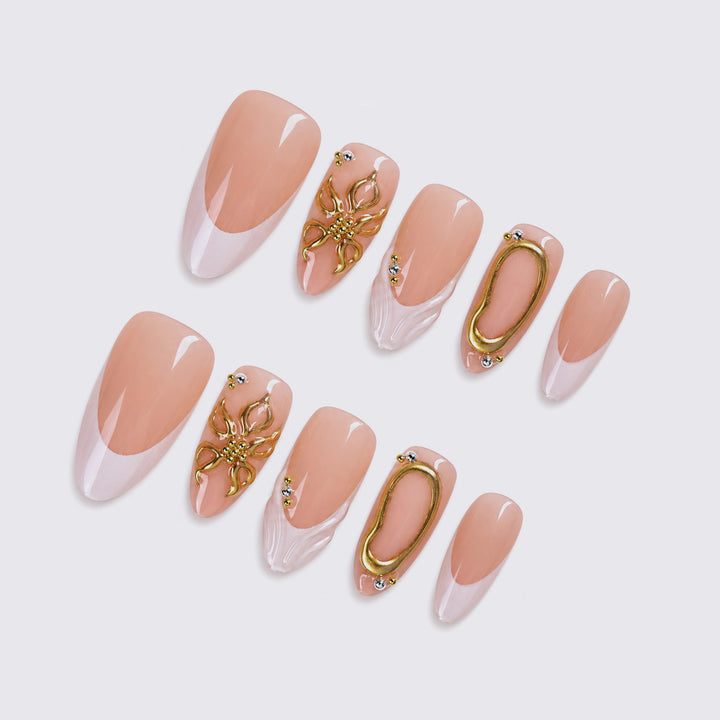 Elegant artificial nails with luxurious golden decorations Stornfield