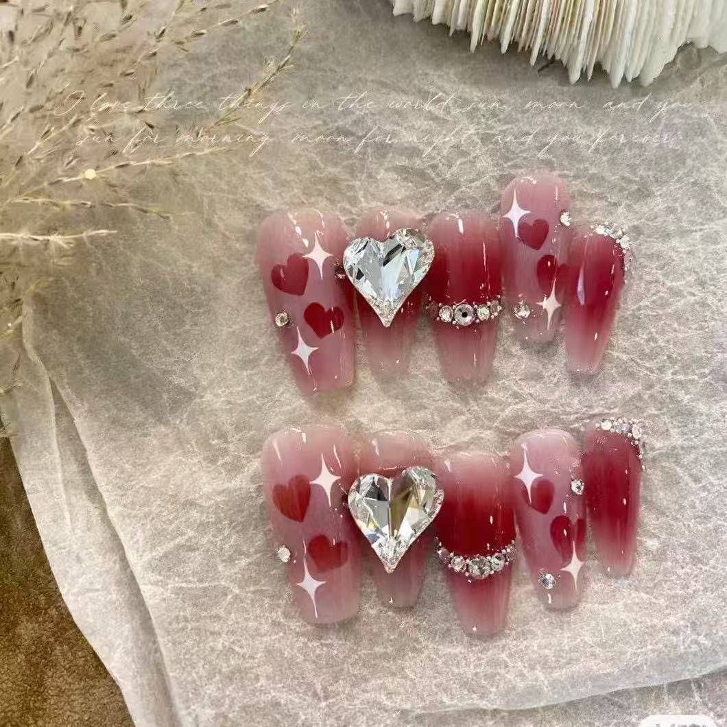 Artificial nails in romantic heart design Stornfield