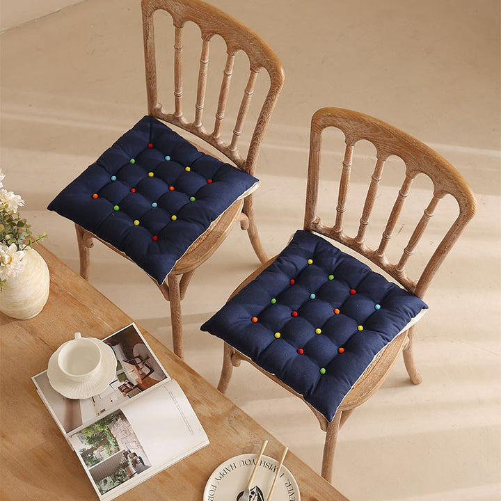 Padded quilted seat cushion with colorful button applications and non-slip underside Stornfield