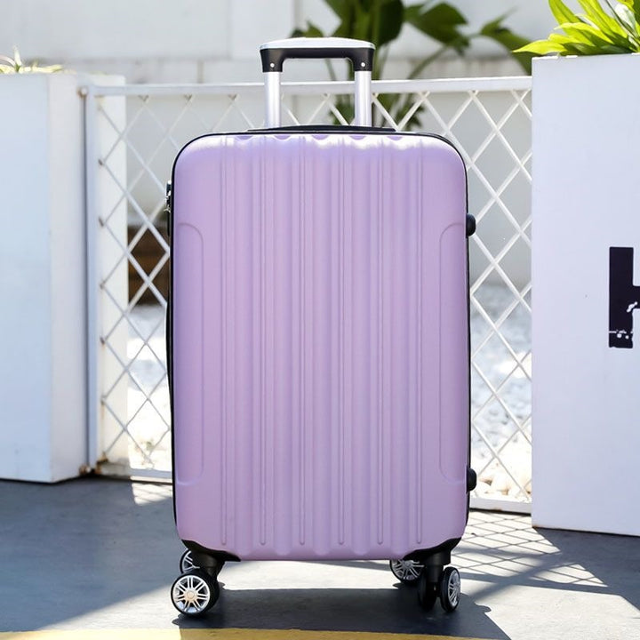 Hard shell suitcase with 360-degree wheel system and integrated safety feature Stornfield
