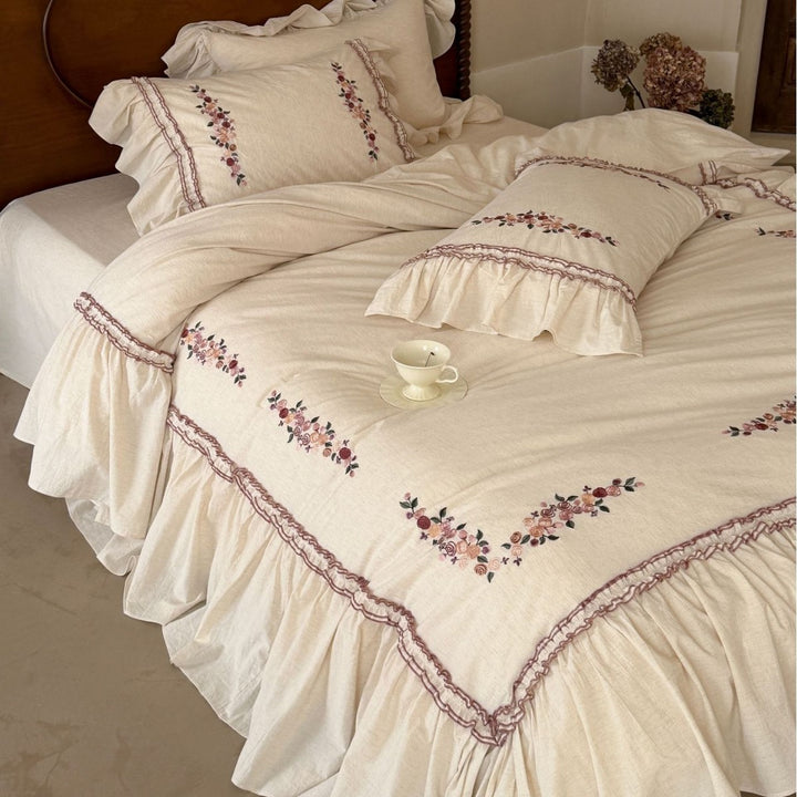 Romantic bedding set with ruffles and floral embroidery in linen look