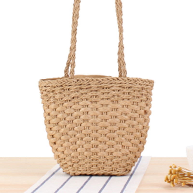 Braided handbag made of natural raffia with robust carrying straps Stornfield