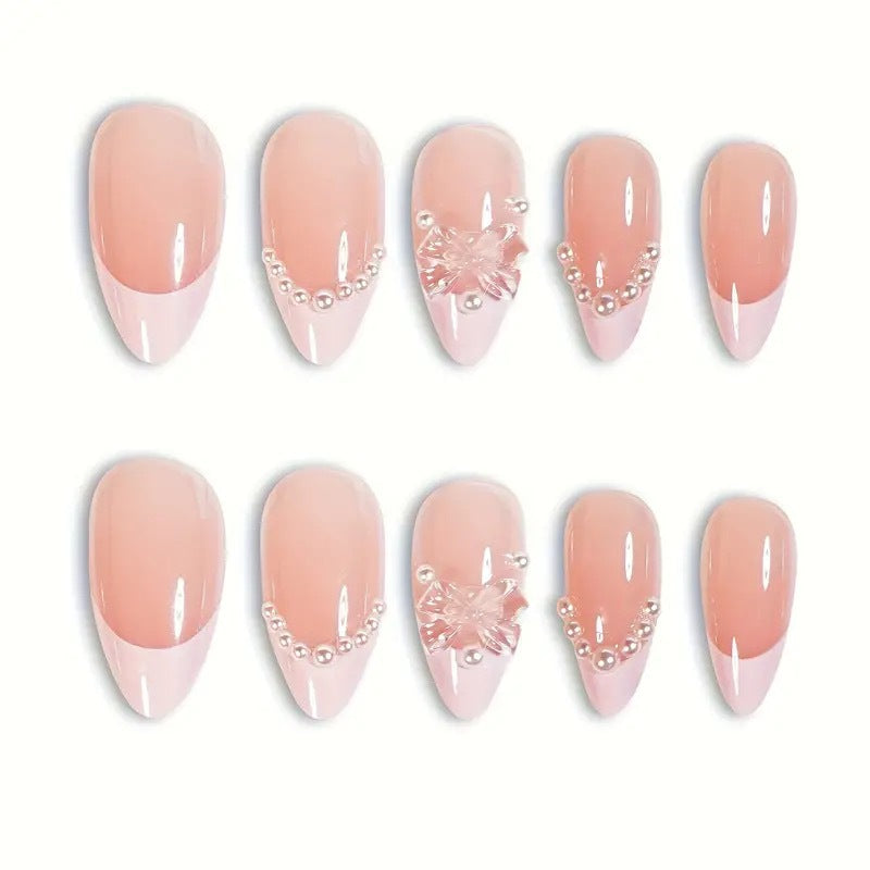 Art nail tips with delicate pearl and butterfly accents Stornfield