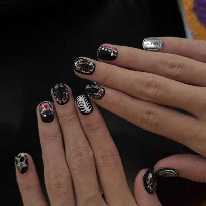 Artificial nail set with creative patterns and glamorous details Stornfield
