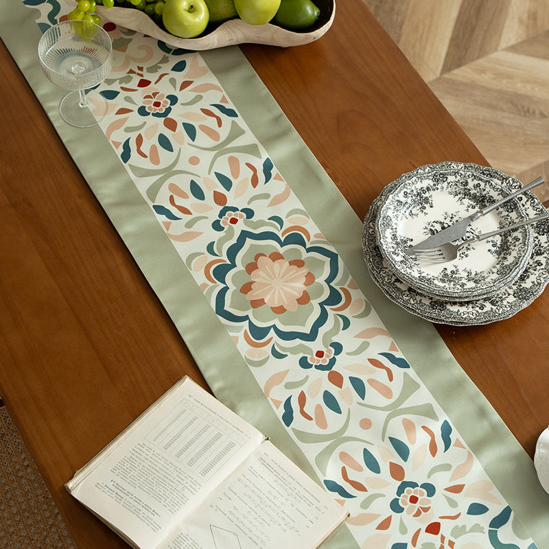 Decorative table runner with oriental tile pattern and tassels Stornfield
