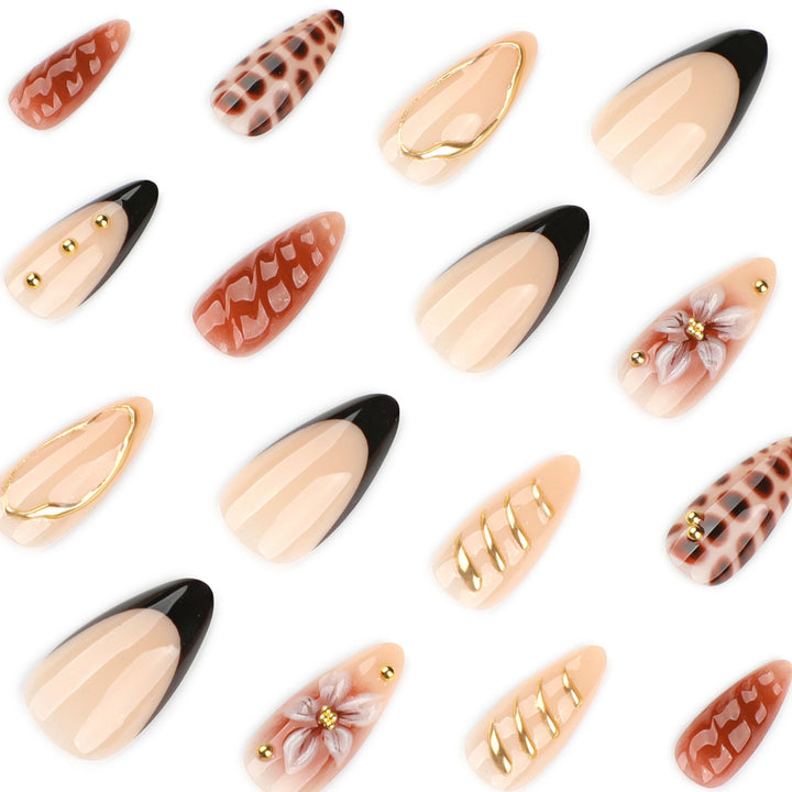 Artificial nails in modern stiletto design with golden accents Stornfield