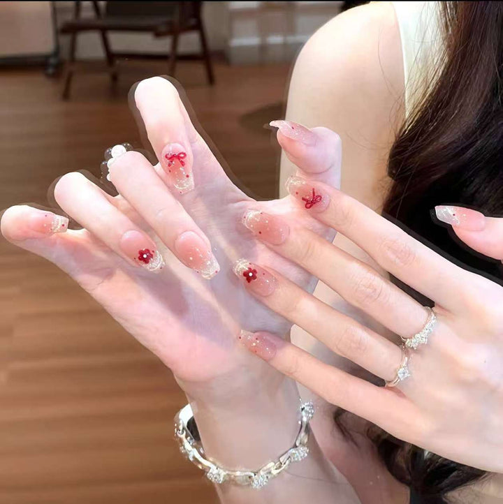 Artistic artificial nails with elegant bow motifs Stornfield