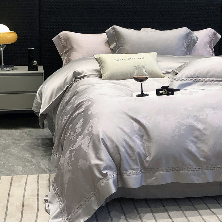 Premium cotton satin bedding set with fine jacquard floral texture and piped border