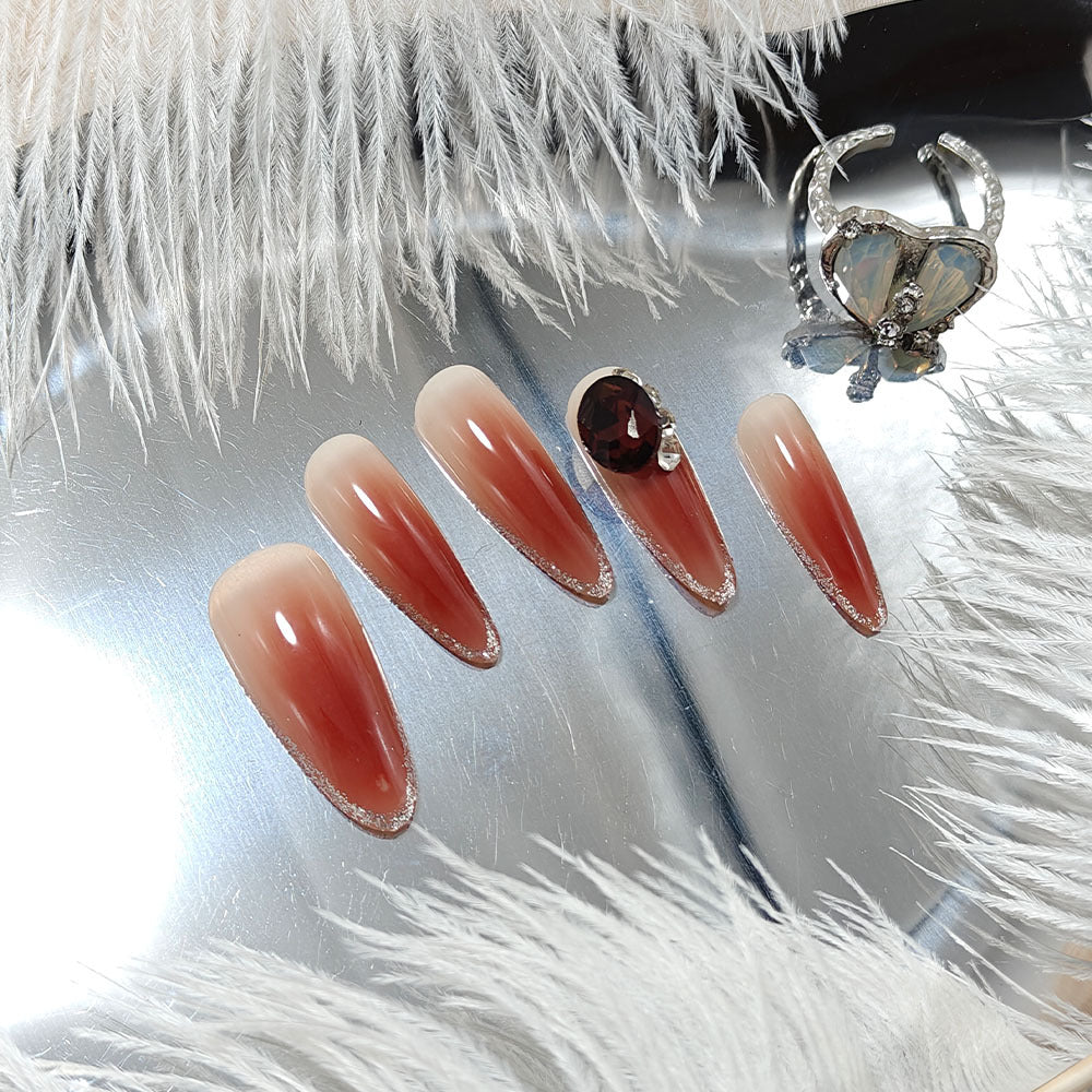 Glittering artificial nails with elegant tip design and crystal decoration Stornfield