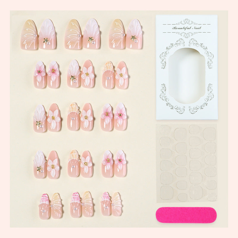 Acrylic nail set with luxuriously designed flower and glitter decorations Stornfield