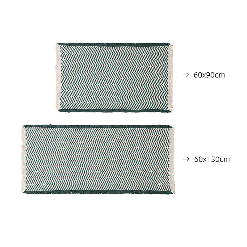 Handwoven cotton bath mat with herringbone pattern and fringes Stornfield