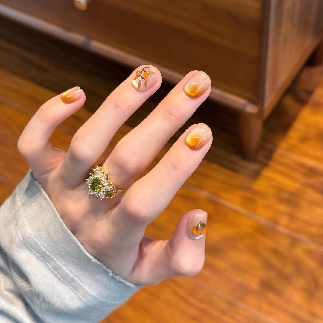 Artificial nails in elegant ombre look with floral accent Stornfield