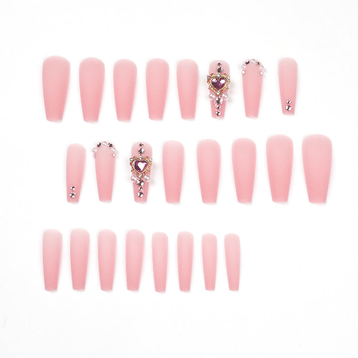 Creative artificial nails with heart-shaped decorative accents Stornfield