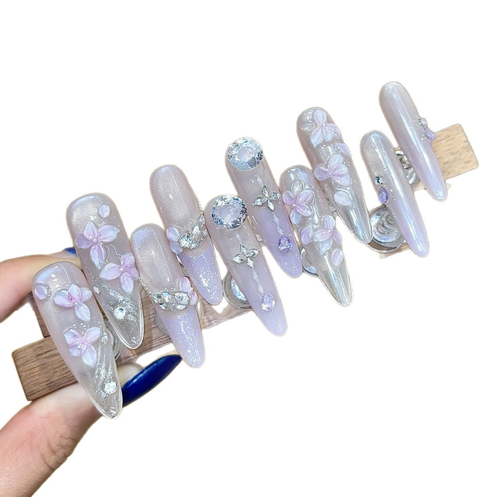 Artificial nails with delicate flower design and glitter accents Stornfield