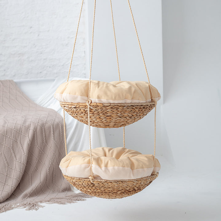 Hanging chair made of braided natural material with comfortable cushions Stornfield