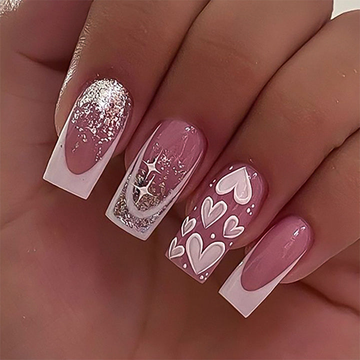 Artful Nail Extensions with Modern Glitter Design and Heart Accents Stornfield