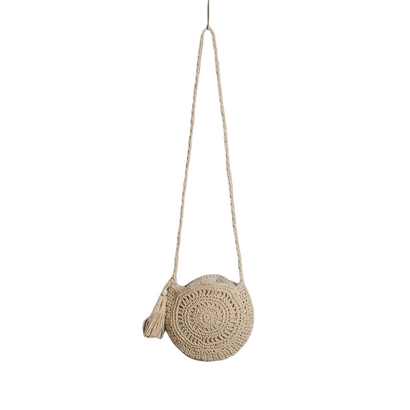 Round bag made of natural jute material with trendy fringe detail Stornfield
