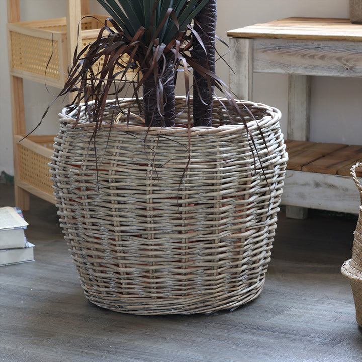 Stylish laundry basket made of braided natural material Stornfield