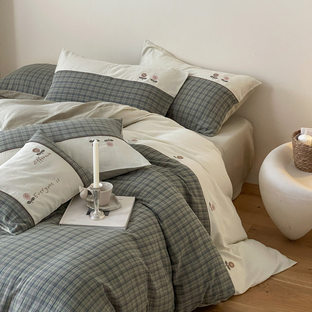 Luxurious cotton bedding set with check pattern and embroidered floral appliqués