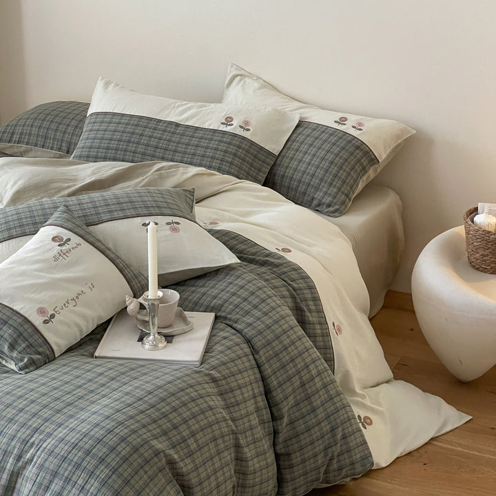 Luxurious cotton bedding set with check pattern and embroidered floral appliqués
