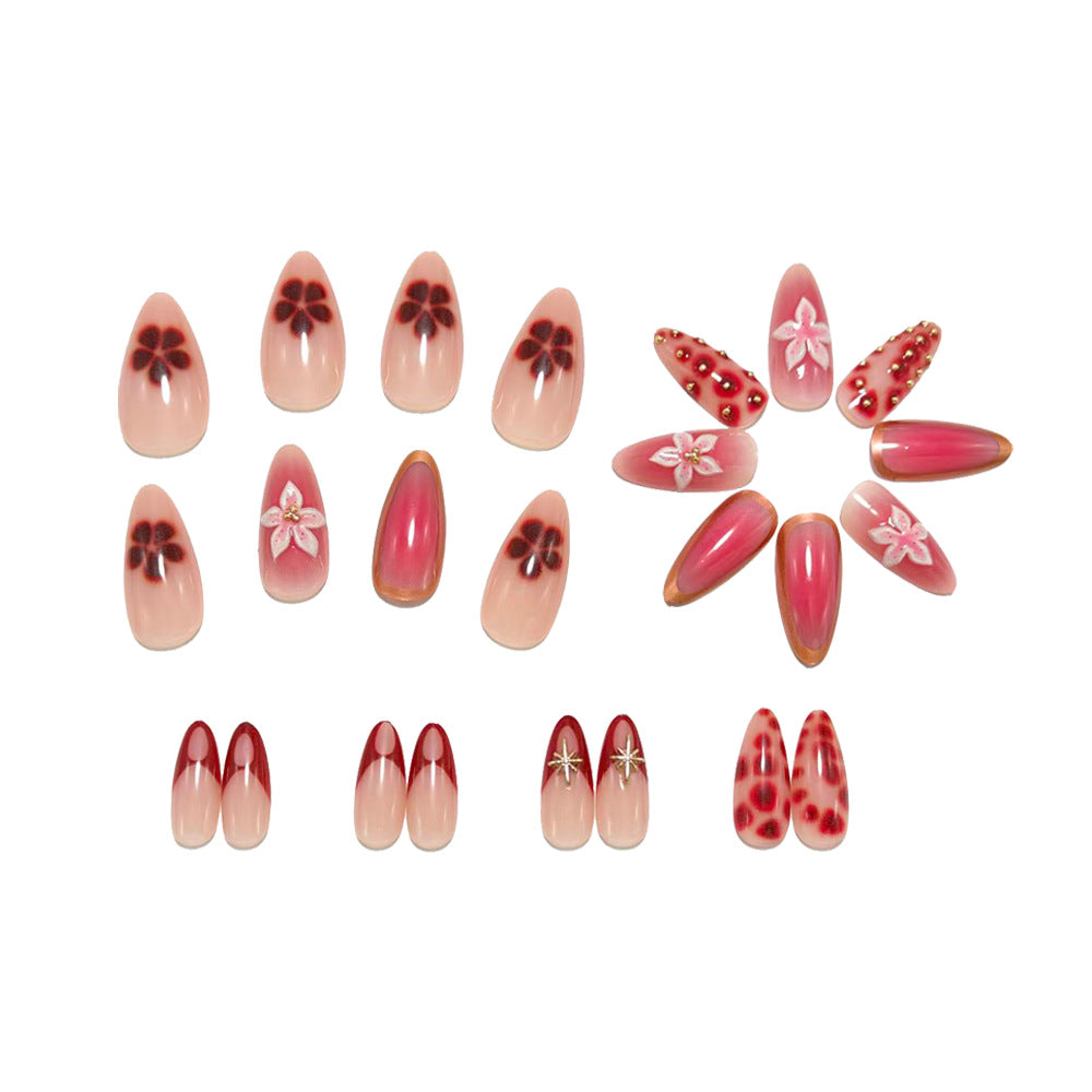 Artificial nails with floral and glitter accents Stornfield