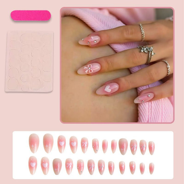 Artificial nail set with delicate bow embellishments Stornfield