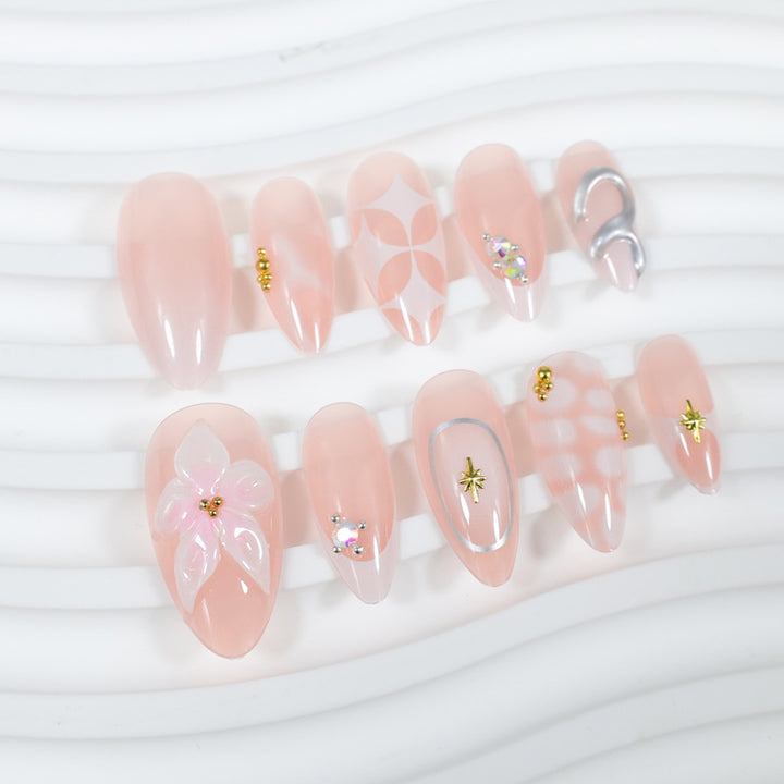 Acrylic nail set with romantic flowers and elegant design elements Stornfield