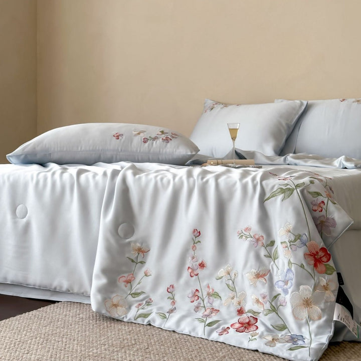 Luxurious bed linen set made of cotton satin with tonal floral embroidery and hotel closure
