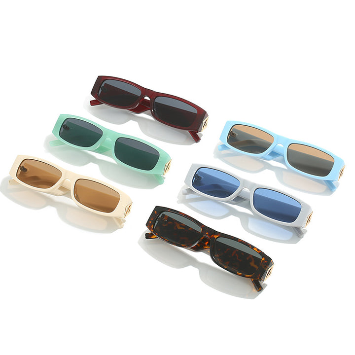 Ladies fashionable sunglasses with asymmetrical frame and gold-colored details Stornfield
