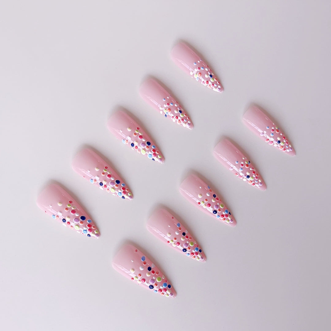 Acrylic nail set with colorful glitter dots and elegant tips Stornfield