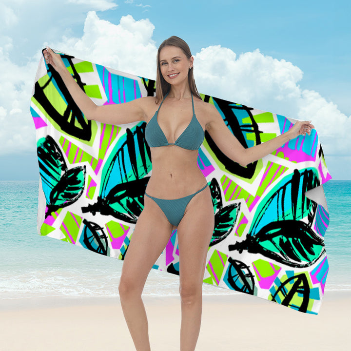 Beach towel with vibrant tropical plant motif Stornfield