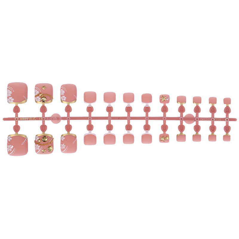 Artificial nail set with elegant, floral accents and golden decorations Stornfield