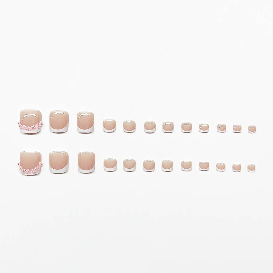 Nail art set with elegant French design and glamorous rhinestone accents Stornfield