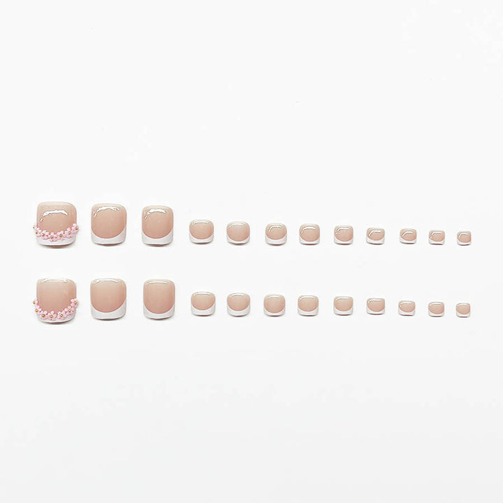 Nail art set with elegant French design and glamorous rhinestone accents Stornfield